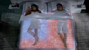 A couple sharing one bed with different preferred comfort temperatures
